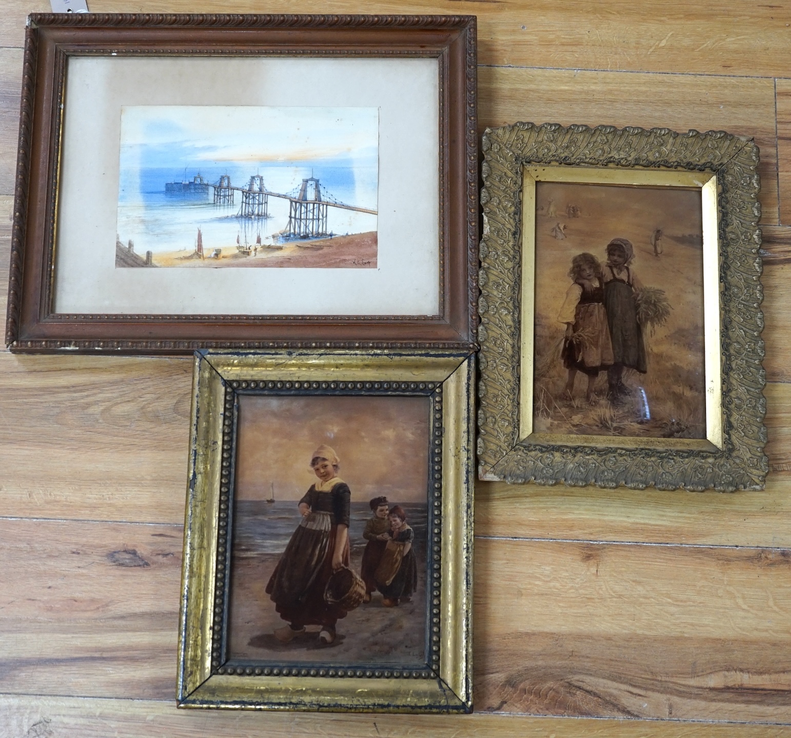 Two Victorian crystoleums including after Edmond Louyot (French, 1861-1920), Children on a beach, copyright 1906 by Franz Hanfstaengl, and a 19th century watercolour of a pier by W.A. Earp, 25 x 16cm. Condition - fair